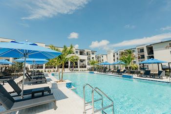 Resort style swimming pool with cabanas