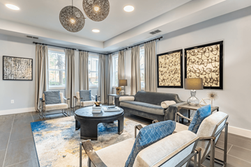 Savannah apartment for rent - A living room with a black coffee table and a blue rug.