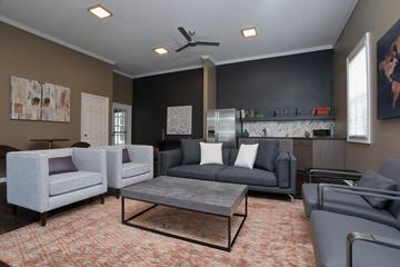 St. Augustine apartment for rent - A living room with a grey couch and a coffee table.