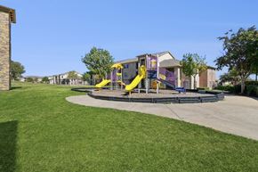 Fort Worth apartment for rent - A playground with apartments in the background