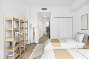 South Miami apartment for rent - a bedroom with a large bed and a book shelf