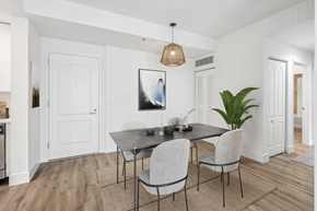 South Miami apartment for rent - a dining room with white walls and a table and chairs