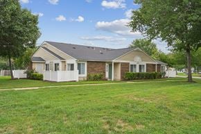 Waldorf apartment for rent - A house with a white picket fence and a green lawn.