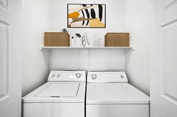 Laundry room with side by side washer and dryer