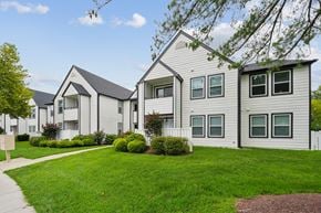 Waldorf apartment for rent - A row of houses with green lawns in front.