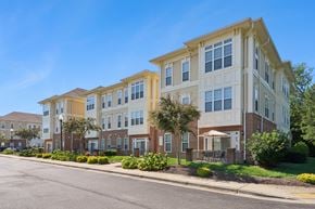 Waldorf apartment for rent - A row of townhouses with a clear blue sky above them.