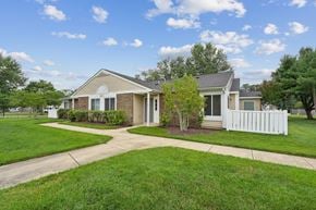 Waldorf apartment for rent - A house with a white picket fence in front.