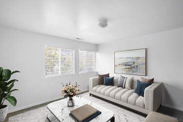 Lehi apartment for rent - A living room with a couch, coffee table, and a painting on the wall.