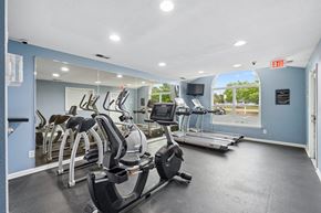 Fredericksburg apartment for rent - A gym with treadmills, exercise bikes, and elliptical machines.
