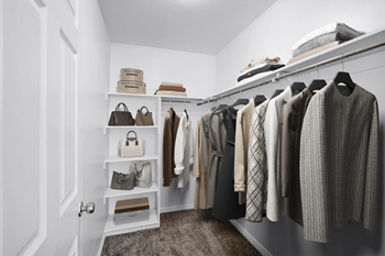 Organized walk-in closet with neutral color palette