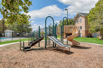 Childrens playground with spiral slide and climbing equipment
