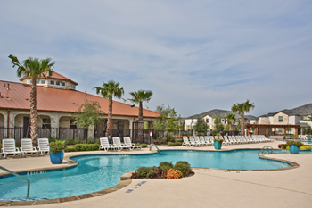 Resort-style swimming pool with sundeck