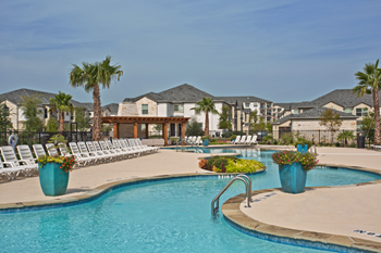 Resort-style swimming pool with sundeck