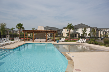 Resort-style swimming pool with sundeck