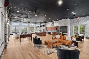 Austin apartment for rent - A modern living room with a large sofa and a coffee table.