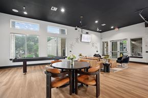 Austin apartment for rent - A modern dining room with a large table and chairs.