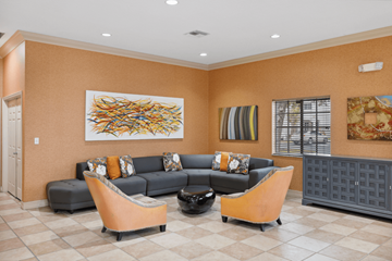 Fort Lauderdale apartment for rent - A living room with a grey couch and orange chairs.