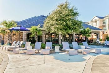 Resort-style swimming pool with sundeck