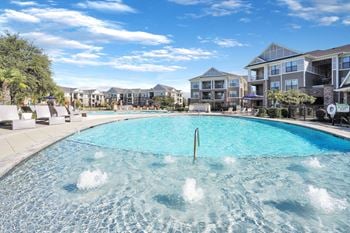 Resort-style swimming pool with sundeck
