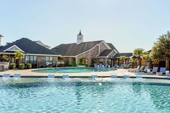 Resort-style swimming pool with sundeck
