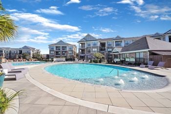 Resort-style swimming pool with sundeck