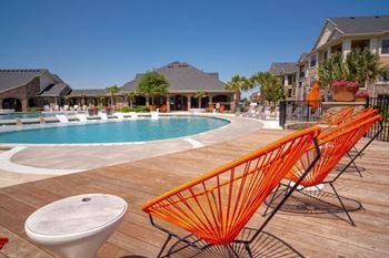 Resort-style swimming pool with sundeck