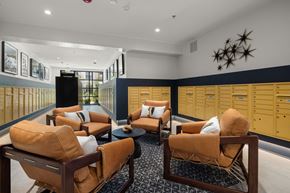 Wilmington apartment for rent - a lounge area with couches and chairs and lockers