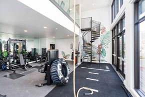 Oakland apartment for rent - A gym with a rope in the middle of the floor.