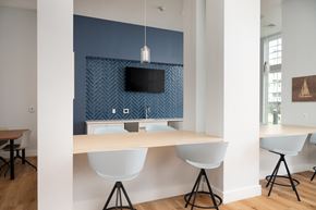 Bay Shore apartment for rent - a dining area with a table and chairs and a television