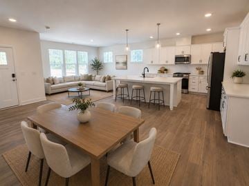 Wake Forest townhouse for rent - A modern kitchen with a dining table and chairs.