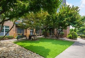 Charlotte apartment for rent - A Green Lawn in Front of a Building at Elizabeth Square Apartments, Charlotte, NC, 28204