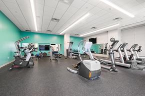 Pittsburgh apartment for rent - a room filled with lots of exercise equipment