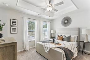 Flowery Branch townhouse for rent - a bedroom with a large bed and a ceiling fan