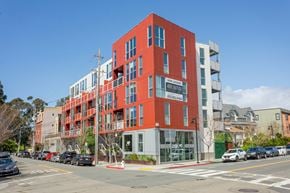 Oakland apartment for rent - A red building with a sign that says "The Standard" on it.