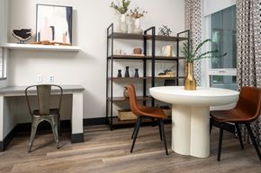Denver apartment for rent - A dining area with a white table and chairs.