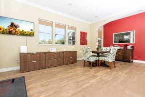 Cupertino apartment for rent - a dining room with red walls and a table and chairs