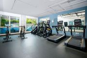Seattle apartment for rent - A gym with treadmills, exercise bikes, and a rowing machine.