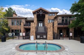 Erie townhouse for rent - A large house with a pool in front.