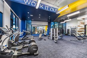 Redwood City apartment for rent - a gym with cardio equipment and weights at a work it out space