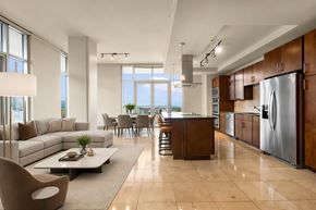 Denver apartment for rent - A modern kitchen with a refrigerator on the right side.