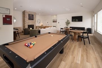 Rock Springs apartment for rent - A pool table is in the middle of a living room.