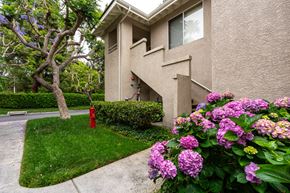 Santa Ana apartment for rent - a house with flowers and a fire hydrant in front of it