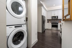 Irvine apartment for rent - A Whirlpool washing machine is in a laundry room.