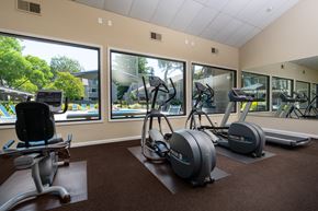 Walnut Creek apartment for rent - A gym with a row of treadmills and elliptical machines.
