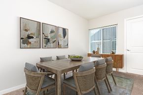 Walnut Creek apartment for rent - A dining room with a wooden table and chairs.