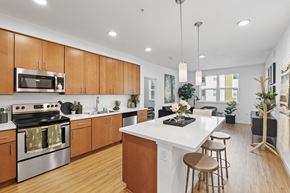 Milpitas apartment for rent - The Edge Milpitas CA a kitchen with white countertops and wooden cabinets