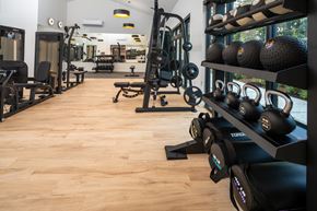 University Place apartment for rent - A gym with a variety of equipment including weights and machines.