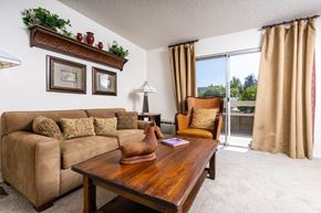 San Ramon apartment for rent - A living room with a couch, a table, and a window.