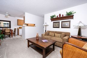 San Ramon apartment for rent - A living room with a couch, chair, and table.