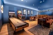 Redmond apartment for rent - A room with a shuffleboard table and a pool table.
